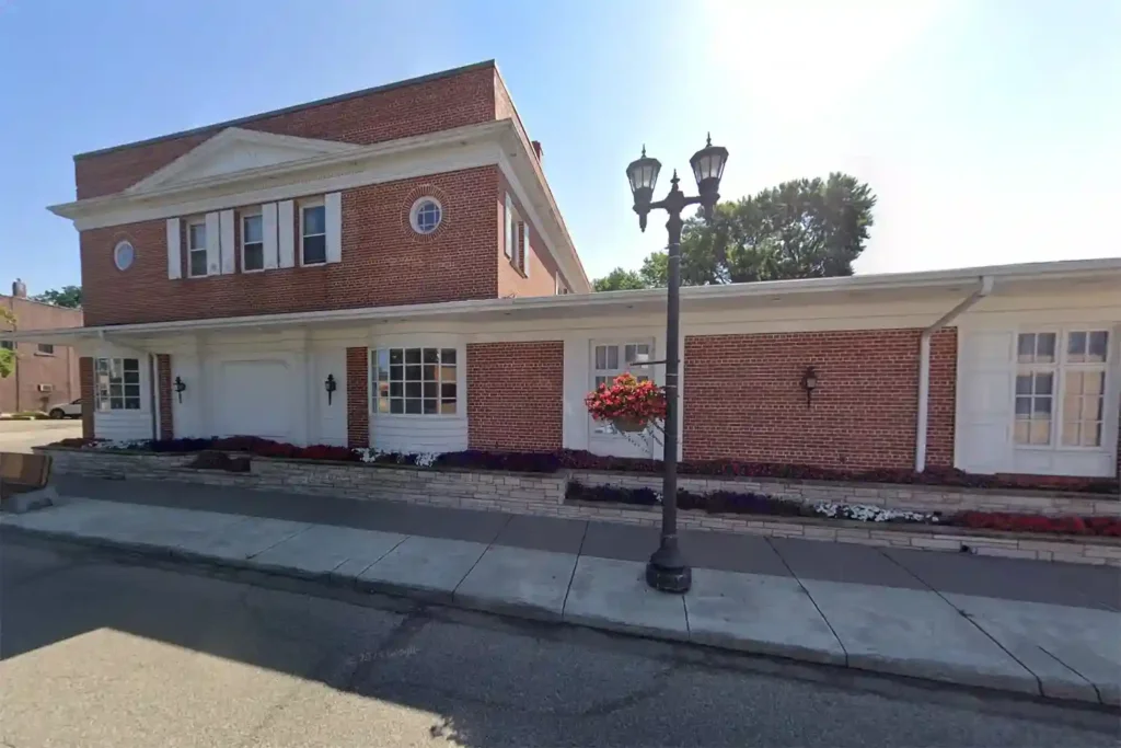 Exterior view of Bradshaw Funeral Home on Rice Street in St. Paul, MN, showcasing the welcoming entrance and tranquil atmosphere for families seeking funeral services.