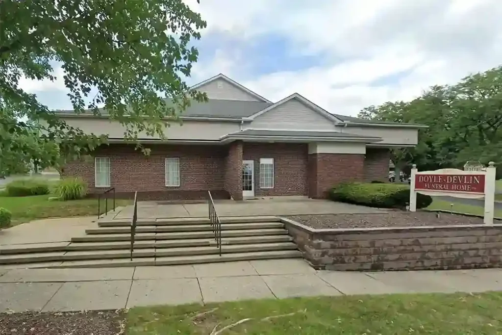 Devlin Funeral Home exterior during sunset, showcasing the peaceful setting and professional services.