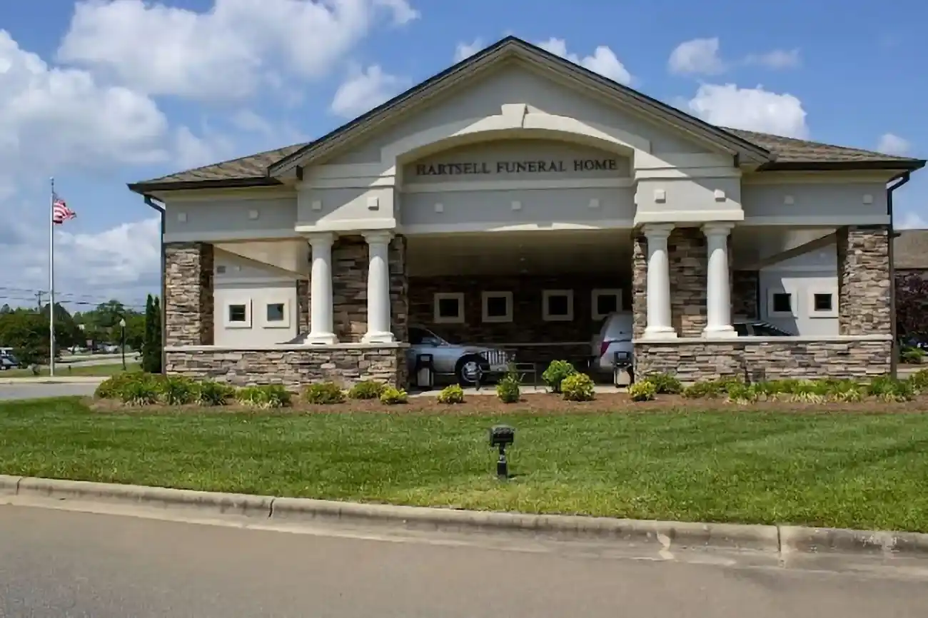 Exterior view of North Hartsell Funeral Home Harrisburg, showcasing the peaceful surroundings and accessible entrance.