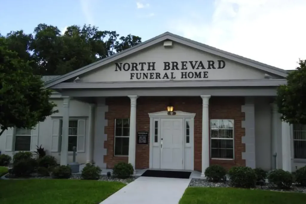 Exterior view of North Brevard Funeral Home Titusville Florida, showcasing its well-maintained building and serene surroundings.