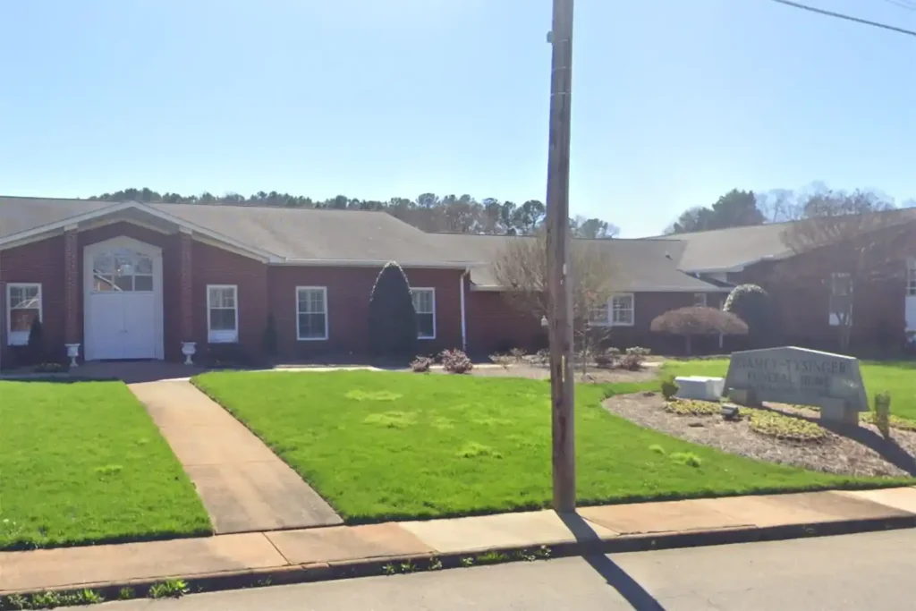 Exterior view of Stamey Funeral Home Fallston NC, showcasing its welcoming entrance and serene surroundings.